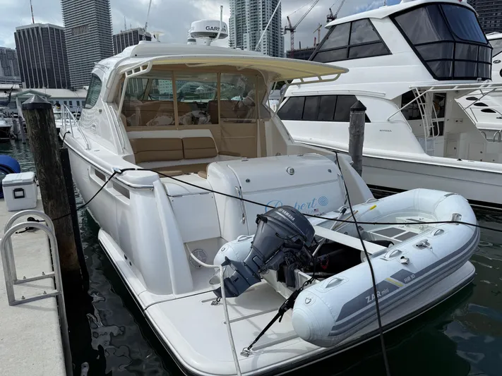  Yacht Photos Pics 2014 Tiara Yachts 4500 Sovran docked with inflatable boat attached.