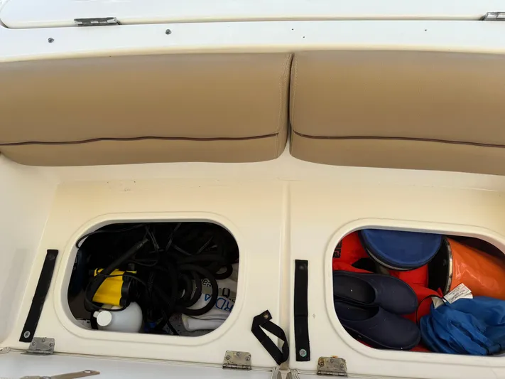  Yacht Photos Pics Storage compartments on a 2014 Tiara Yachts 4500 Sovran, filled with boating gear.