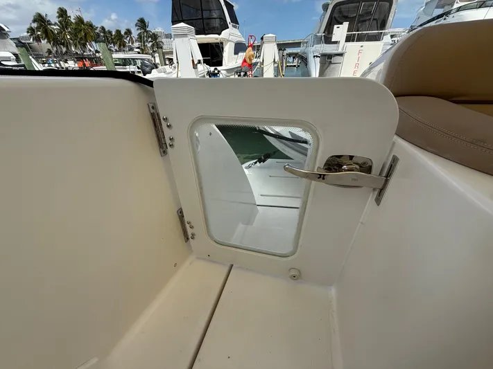  Yacht Photos Pics Tiara Yachts 4500 Sovran 2014, interior view with open hatch, marina background.