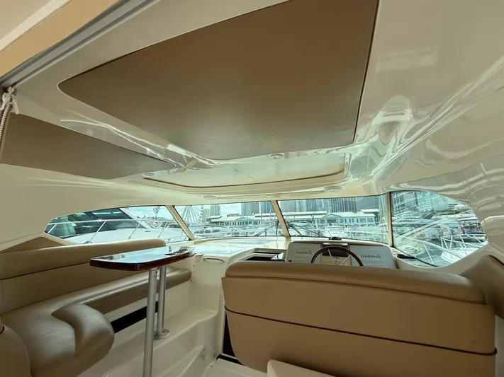  Yacht Photos Pics Interior of 2014 Tiara Yachts 4500 Sovran, featuring luxurious seating and helm.