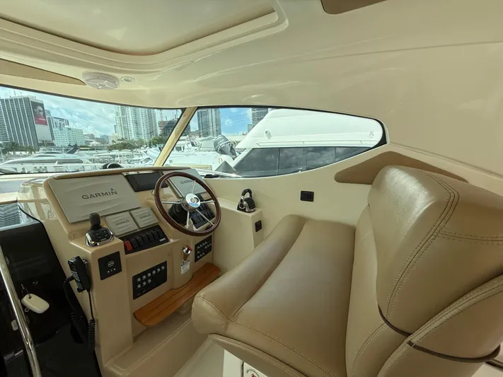  Yacht Photos Pics Interior of 2014 Tiara Yachts 4500 Sovran, featuring helm and leather seating.