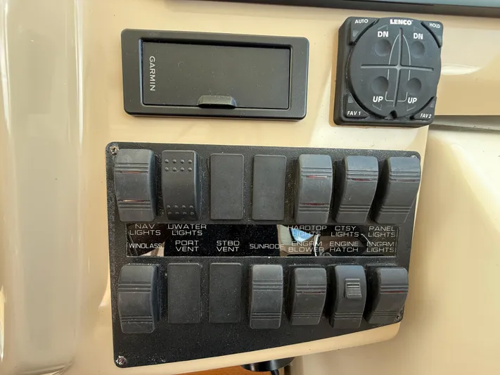 Yacht Photos Pics Control panel of a 2014 Tiara Yachts 4500 Sovran with labeled switches and Garmin device.
