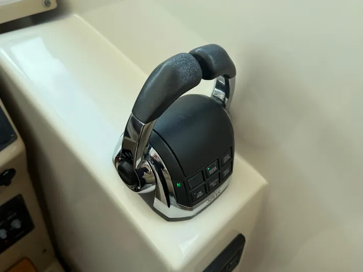  Yacht Photos Pics Throttle control of 2014 Tiara Yachts 4500 Sovran, featuring ergonomic design and control buttons.