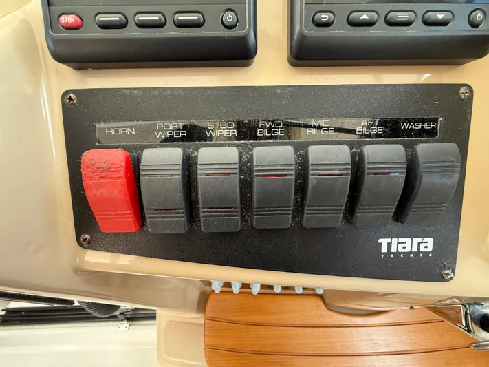  Yacht Photos Pics Control panel of 2014 Tiara Yachts 4500 Sovran with labeled switches.