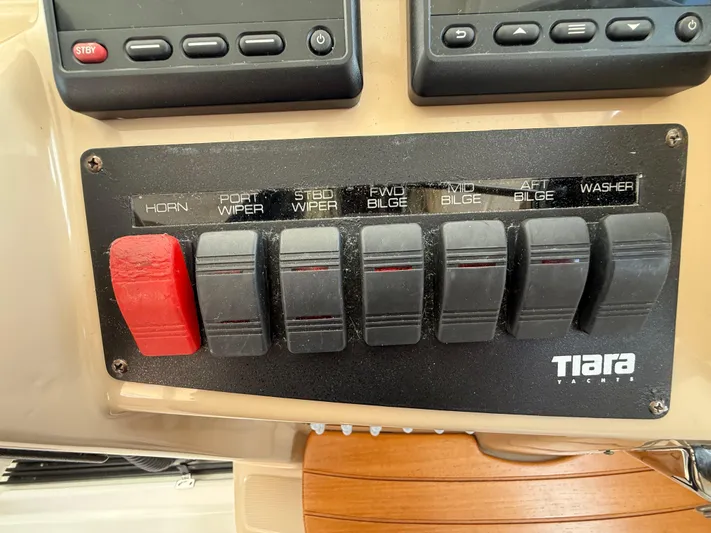 Yacht Photos Pics Control panel of a 2014 Tiara Yachts 4500 Sovran with labeled switches.