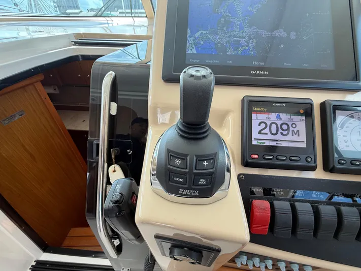  Yacht Photos Pics Control panel of a 2014 Tiara Yachts 4500 Sovran with navigation and throttle controls.