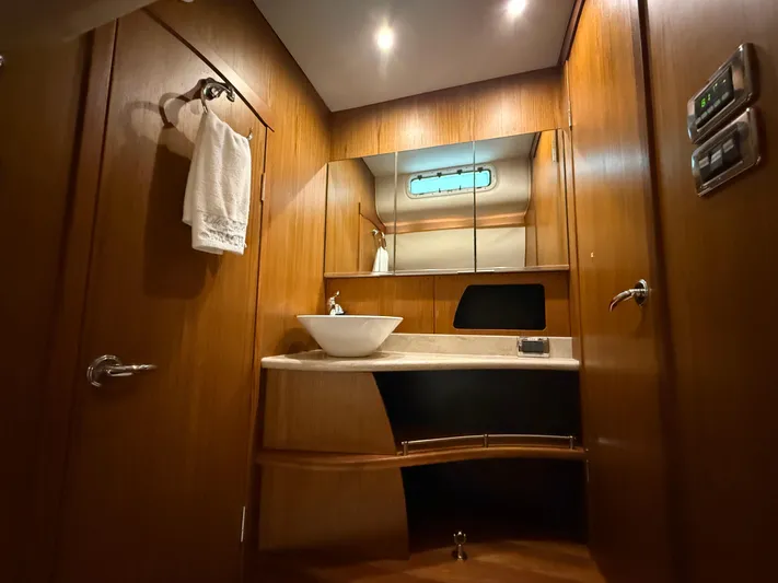  Yacht Photos Pics Luxurious bathroom interior of 2014 Tiara Yachts 4500 Sovran with wood finish.