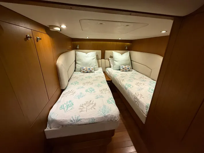  Yacht Photos Pics 2014 Tiara Yachts 4500 Sovran cabin with twin beds and wooden interior.