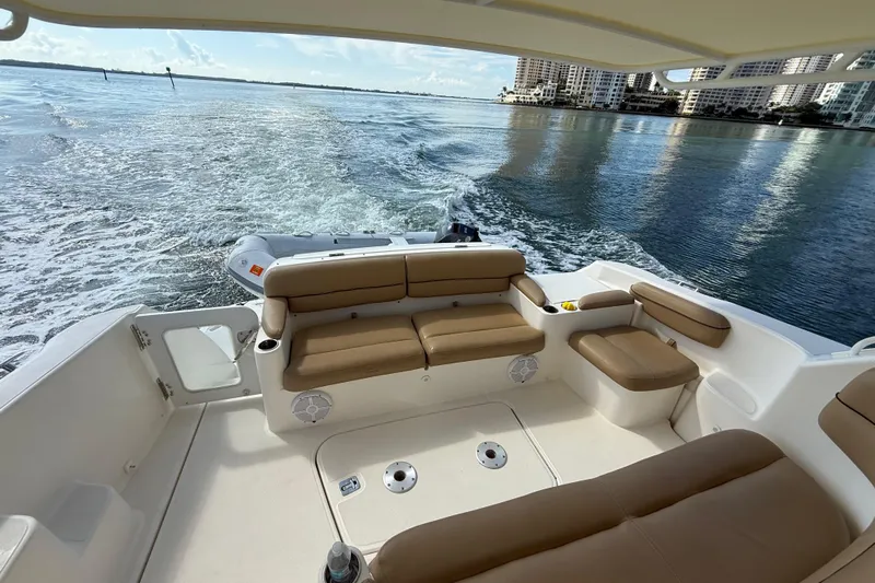  Yacht Photos Pics 2014 Tiara Yachts 4500 Sovran interior with tan seating, cruising on calm waters.