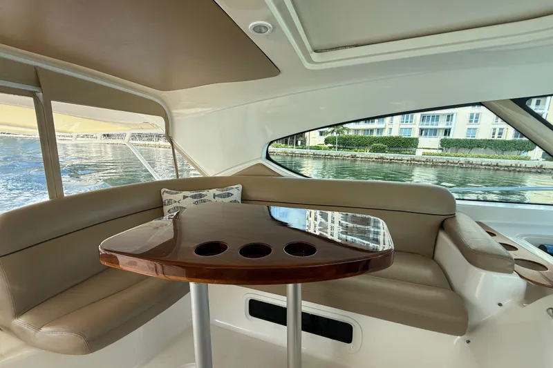  Yacht Photos Pics Interior of 2014 Tiara Yachts 4500 Sovran with elegant seating and polished table.