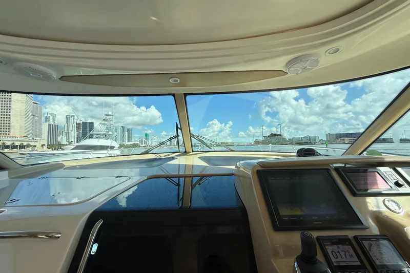  Yacht Photos Pics Interior view from 2014 Tiara Yachts 4500 Sovran, showcasing dashboard and city skyline.