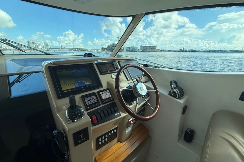  Yacht Photos Pics Interior helm of 2014 Tiara Yachts 4500 Sovran with navigation controls and ocean view.