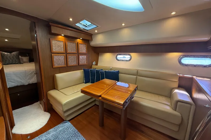  Yacht Photos Pics Luxurious interior of 2014 Tiara Yachts 4500 Sovran with elegant seating and wooden accents.