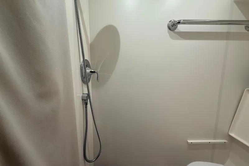  Yacht Photos Pics Shower area in 2014 Tiara Yachts 4500 Sovran, featuring chrome fixtures and towel bar.