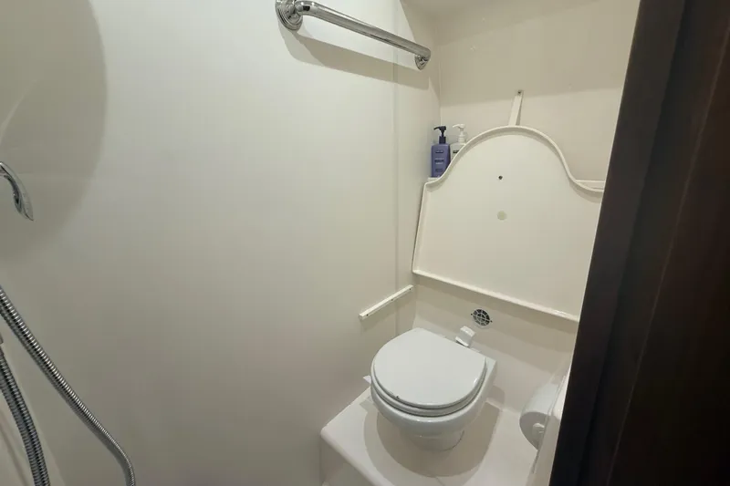  Yacht Photos Pics 2014 Tiara Yachts 4500 Sovran bathroom with toilet and shower amenities.