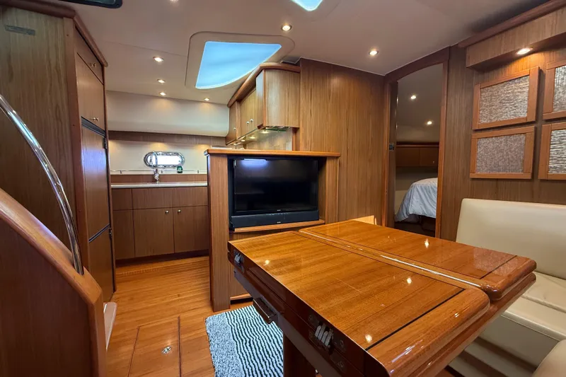  Yacht Photos Pics Luxurious 2014 Tiara Yachts 4500 Sovran interior with wood finish and modern amenities.
