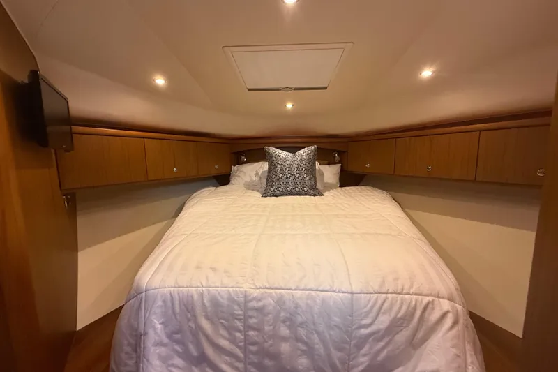  Yacht Photos Pics Luxurious cabin interior of 2014 Tiara Yachts 4500 Sovran with cozy bedding.