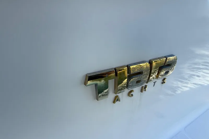  Yacht Photos Pics Tiara Yachts logo on 2014 4500 Sovran model, gold lettering on white background.