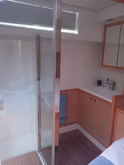 Finisterre Yacht Photos Pics Modern bathroom interior on 2017 Lagoon 52 F yacht, featuring shower and sink.