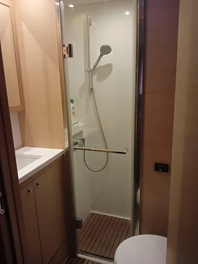 Finisterre Yacht Photos Pics Modern shower in 2017 Lagoon 52 F yacht bathroom with wooden accents.