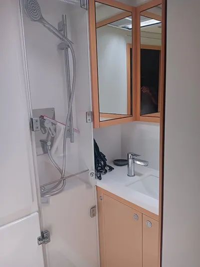 Finisterre Yacht Photos Pics Bathroom interior of 2017 Lagoon 52 F yacht with shower and sink.
