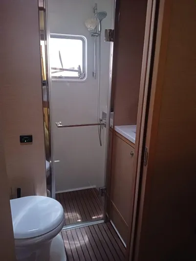 Finisterre Yacht Photos Pics Bathroom interior of 2017 Lagoon 52 F yacht with shower and toilet.