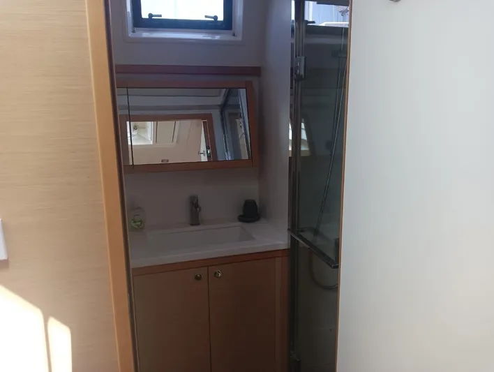 Finisterre Yacht Photos Pics Bathroom interior of 2017 Lagoon 52 F yacht with sink and shower.