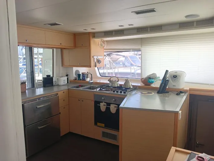 Finisterre Yacht Photos Pics Modern kitchen interior of 2017 Lagoon 52 F yacht with appliances and ample counter space.