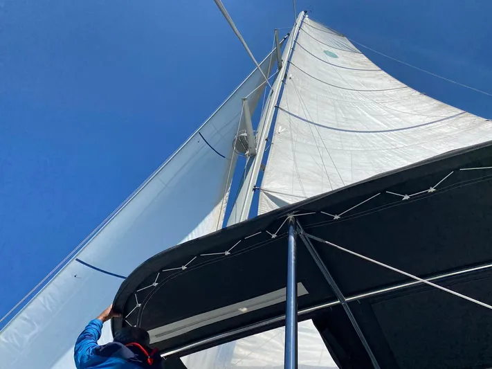 Finisterre Yacht Photos Pics Sailing on a 2017 Lagoon 52 F catamaran under clear blue skies.