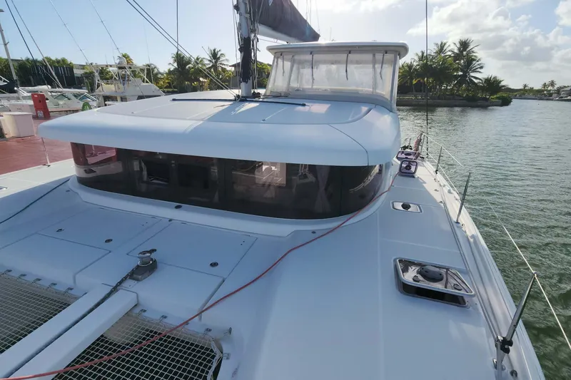  Yacht Photos Pics 2020 Lagoon 42 catamaran docked, featuring sleek design and spacious deck.