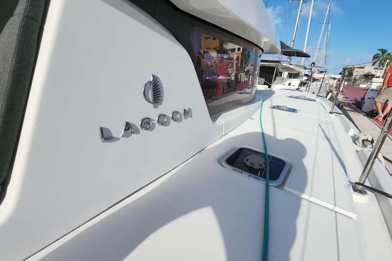 Yacht Photos Pics 2020 Lagoon 42 catamaran docked, showcasing sleek design and branding.