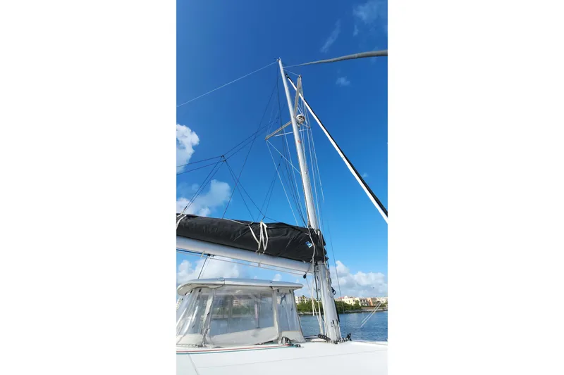  Yacht Photos Pics 2020 Lagoon 42 sailboat mast against a clear blue sky.