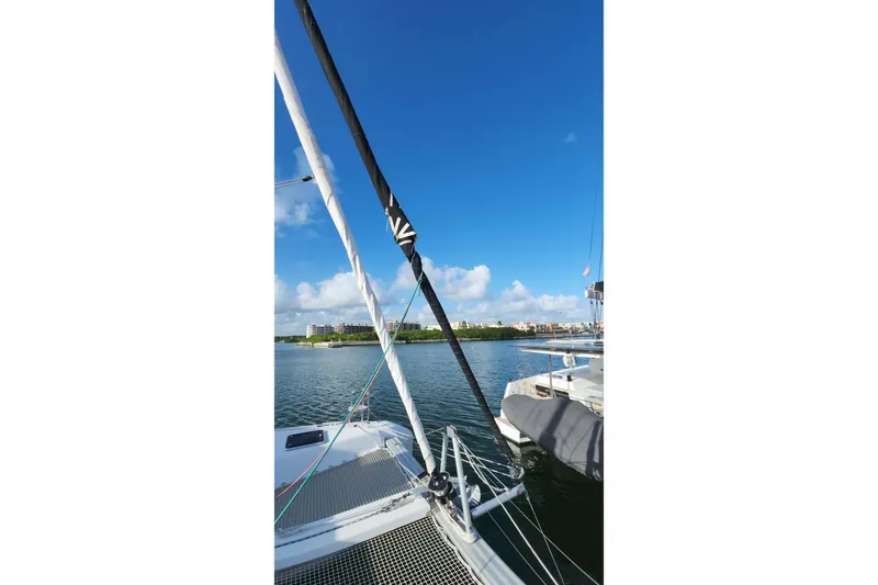  Yacht Photos Pics Sailing on a 2020 Lagoon 42 catamaran with clear blue skies and calm waters.