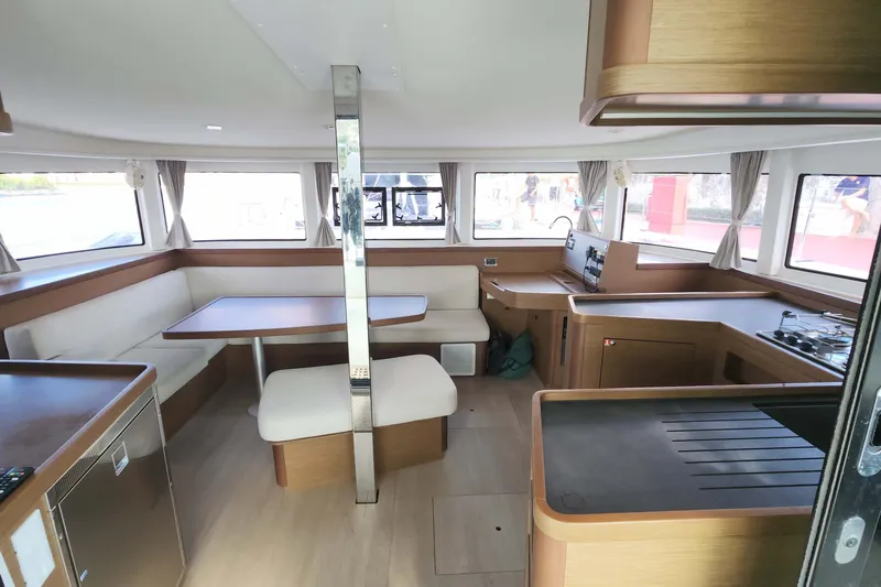  Yacht Photos Pics Interior of 2020 Lagoon 42 catamaran with modern kitchen and dining area.