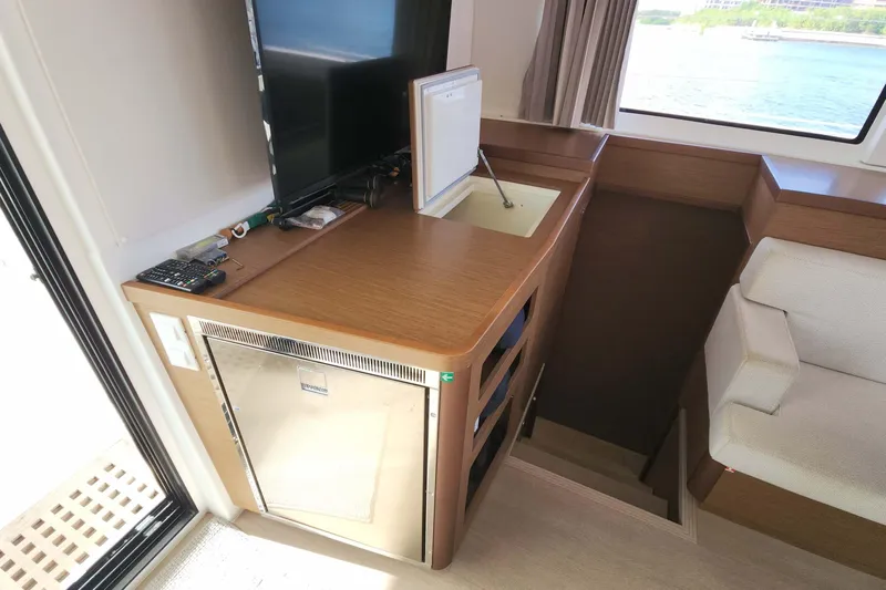  Yacht Photos Pics Interior of 2020 Lagoon 42 yacht with kitchenette and seating area.