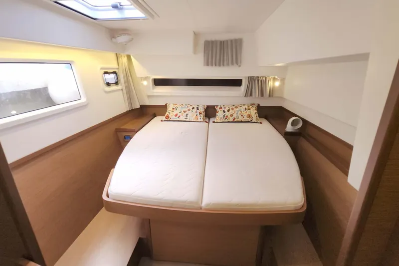  Yacht Photos Pics 2020 Lagoon 42 yacht cabin with double bed, modern design, and natural light.