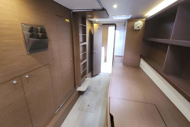  Yacht Photos Pics Interior of 2020 Lagoon 42 yacht, featuring wooden cabinetry and modern design elements.