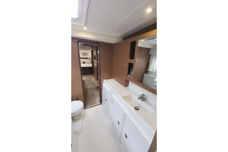  Yacht Photos Pics Modern bathroom interior of 2020 Lagoon 42 yacht, featuring sleek design and ample lighting.