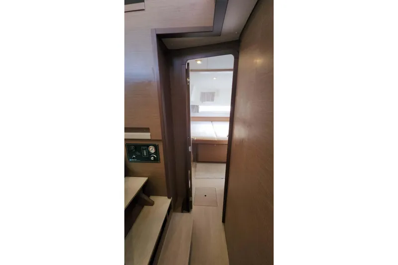  Yacht Photos Pics Interior view of 2020 Lagoon 42 yacht cabin with wooden finish.