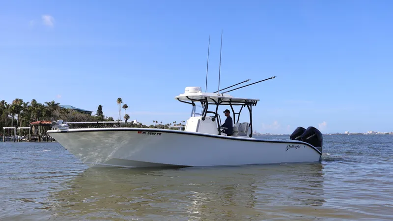  Yacht Photos Pics 2022 Yellowfin 32 Offshore boat on calm water, clear sky background.
