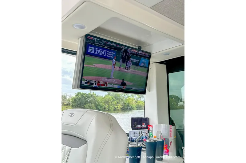 Qss Century Yacht Photos Pics 2024 Regal 36 XO yacht interior with TV showing a baseball game.