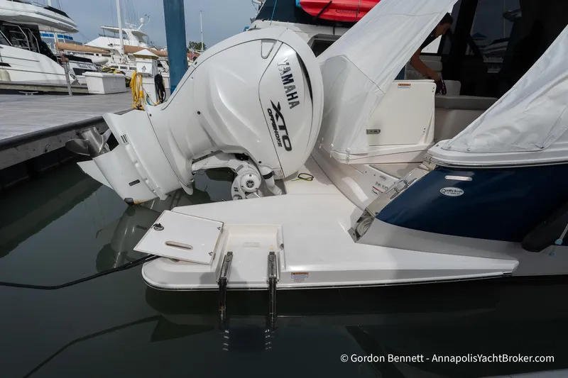 Qss Century Yacht Photos Pics 2024 Regal 36 XO yacht with Yamaha outboard engine at marina dock.