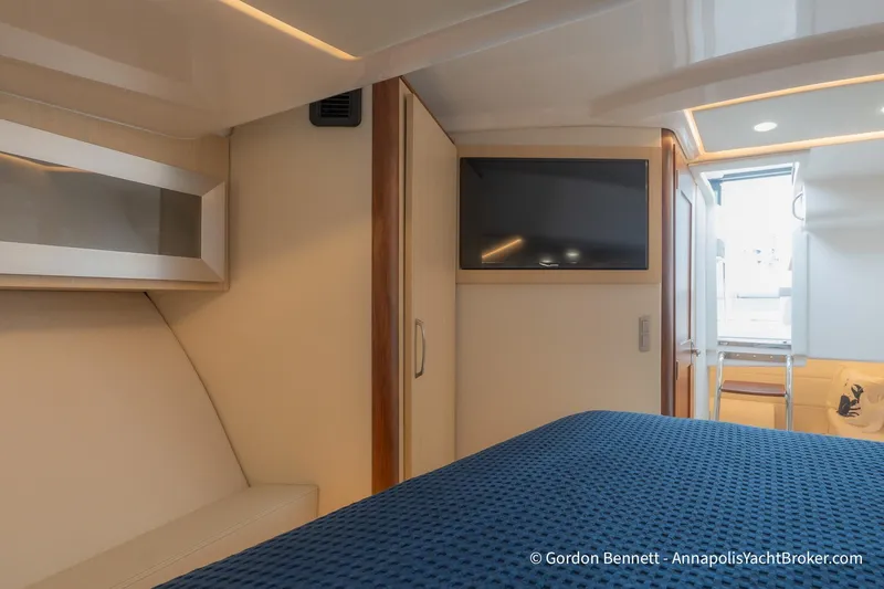 Qss Century Yacht Photos Pics 2024 Regal 36 XO yacht interior with TV, bed, and modern design.