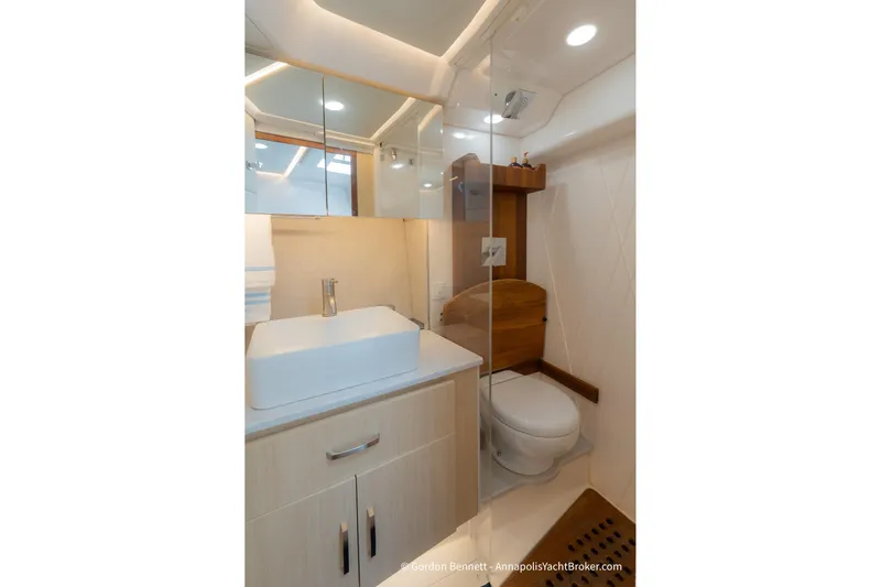 Qss Century Yacht Photos Pics Luxurious bathroom in 2024 Regal 36 XO yacht with modern fixtures and elegant design.
