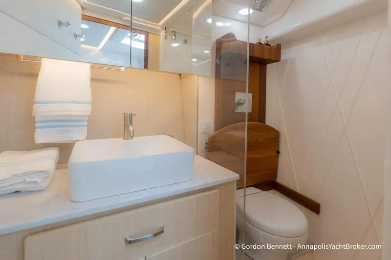 Qss Century Yacht Photos Pics Luxurious bathroom in 2024 Regal 36 XO yacht with modern sink and elegant design.