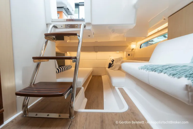 Qss Century Yacht Photos Pics 2024 Regal 36 XO yacht interior with modern seating and wooden steps.