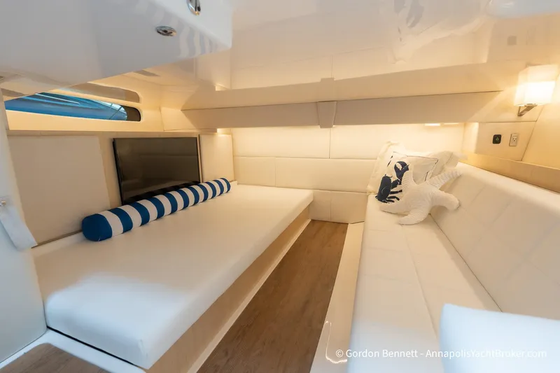 Qss Century Yacht Photos Pics Luxurious interior of 2024 Regal 36 XO yacht with plush seating and elegant decor.