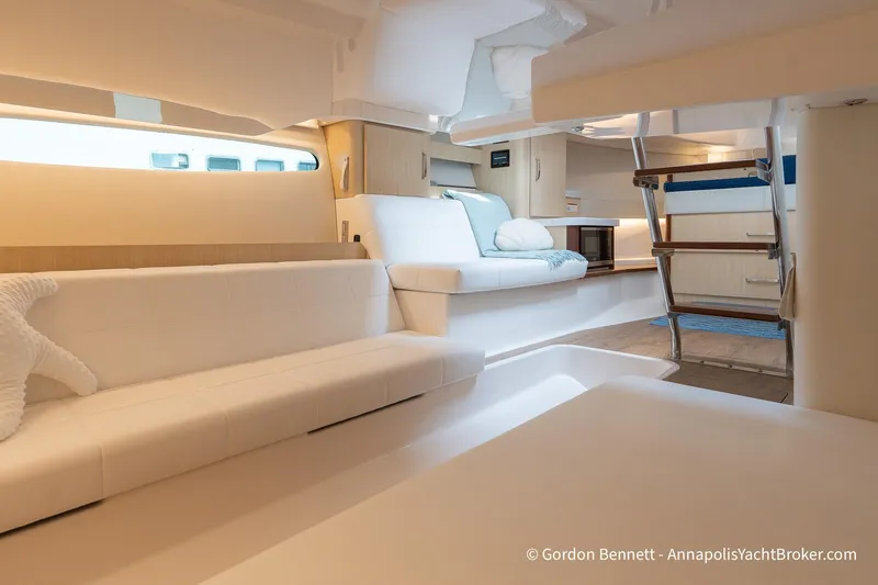 Qss Century Yacht Photos Pics Luxurious interior of 2024 Regal 36 XO yacht with modern seating and elegant design.