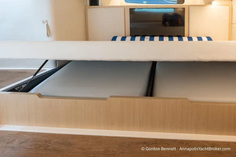Qss Century Yacht Photos Pics 2024 Regal 36 XO yacht interior with under-bed storage compartment open.