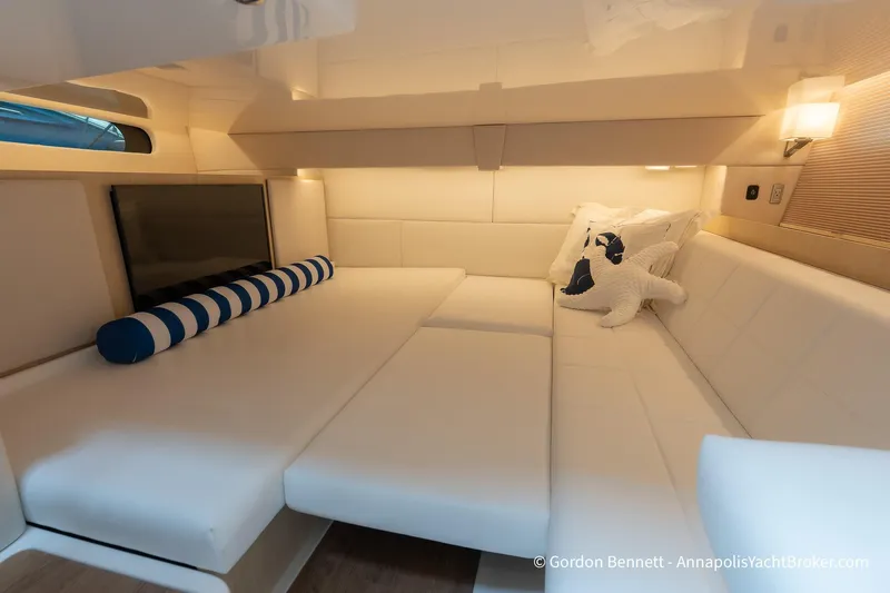 Qss Century Yacht Photos Pics 2024 Regal 36 XO yacht interior with plush white seating and nautical decor.